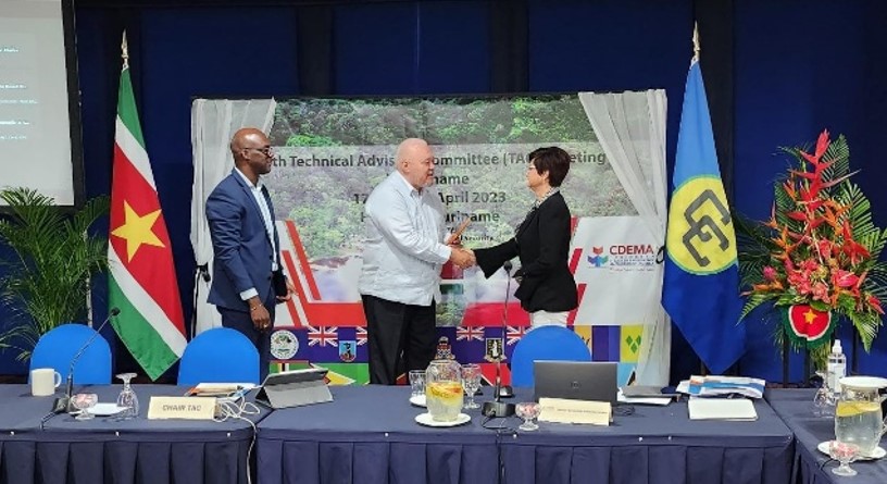 Photo: PROSE Chief of Party, Marianela Guzman, receives an award of appreciation on behalf of PROSE for supporting capacity building on the CDEMA CDM Blueprint & Assessment at the 14th TAC Meeting in Suriname.  From left: Lt. Col. Kester Craig (Deputy Executive Director CDEMA), Col. Jerry Slijngard (Chairman of the CDEMA TAC) and Marianela Guzman.